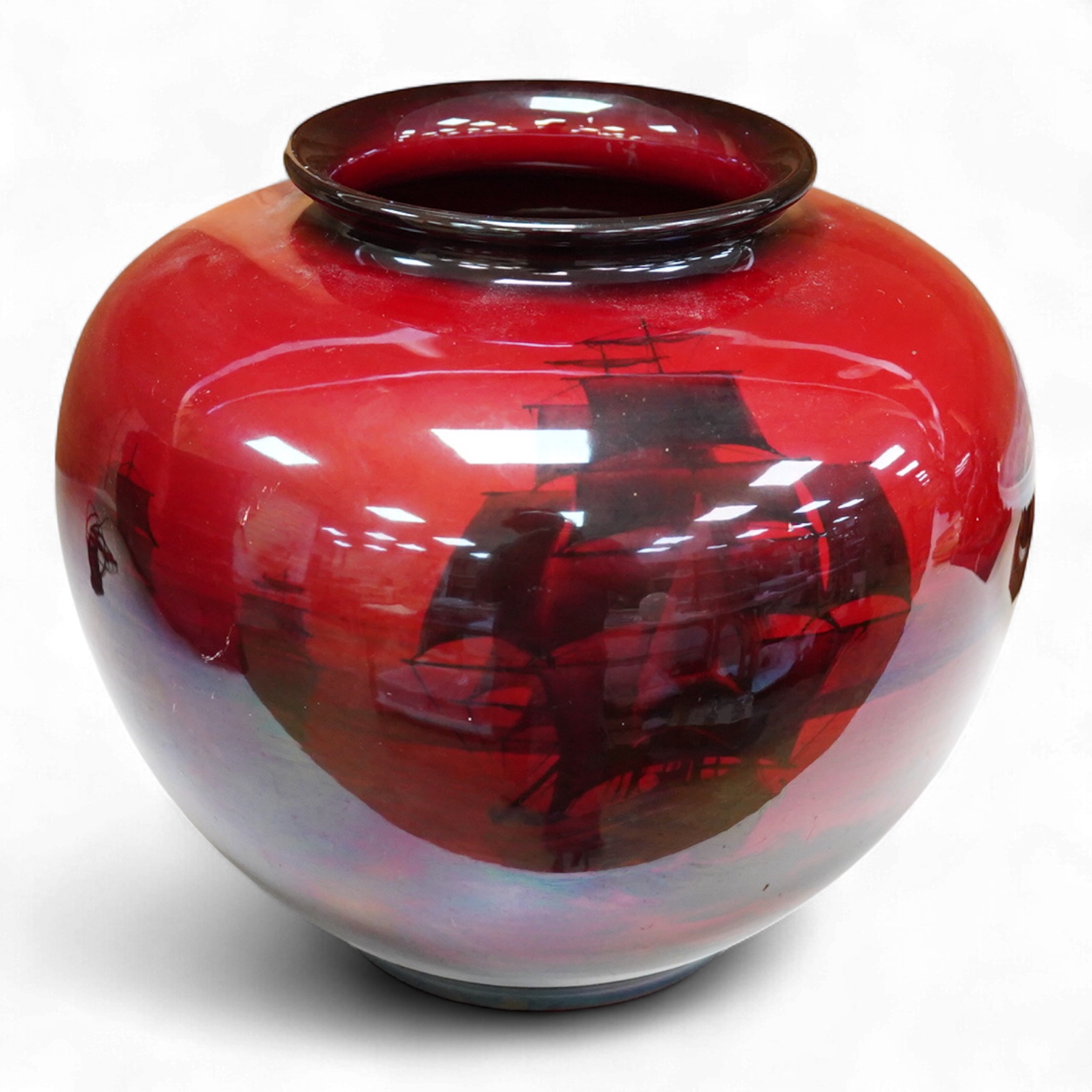 A large Doulton flambe vase decorated with ships, 29cm high